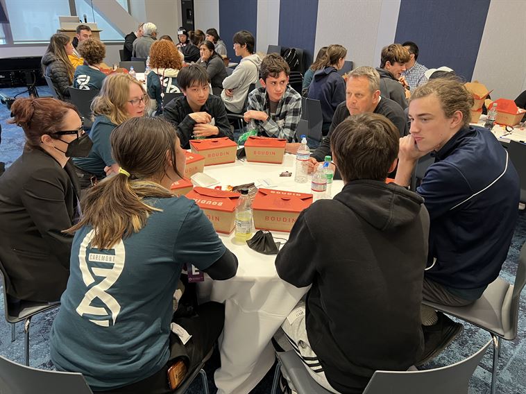 Students eating lunch with professionals at Genentech